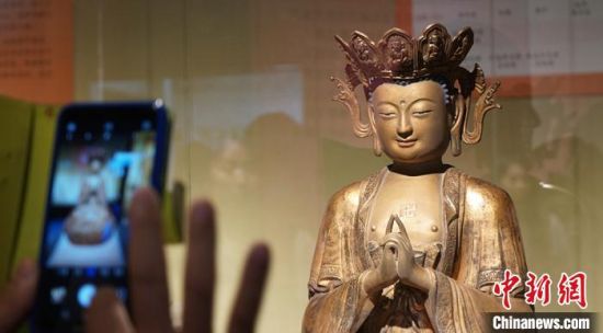 图为敦煌研究院举办的佛教艺术展。(资料图) 魏建军 摄 图为敦煌研究院举办的佛教艺术展。(资料图) 魏建军 摄